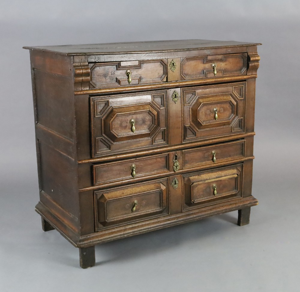 A late 17th century oak chest, of four long drawers with geometric moulded decoration, on stile feet, W.3ft 9in. D.1ft 11in. H.3ft 3in.
